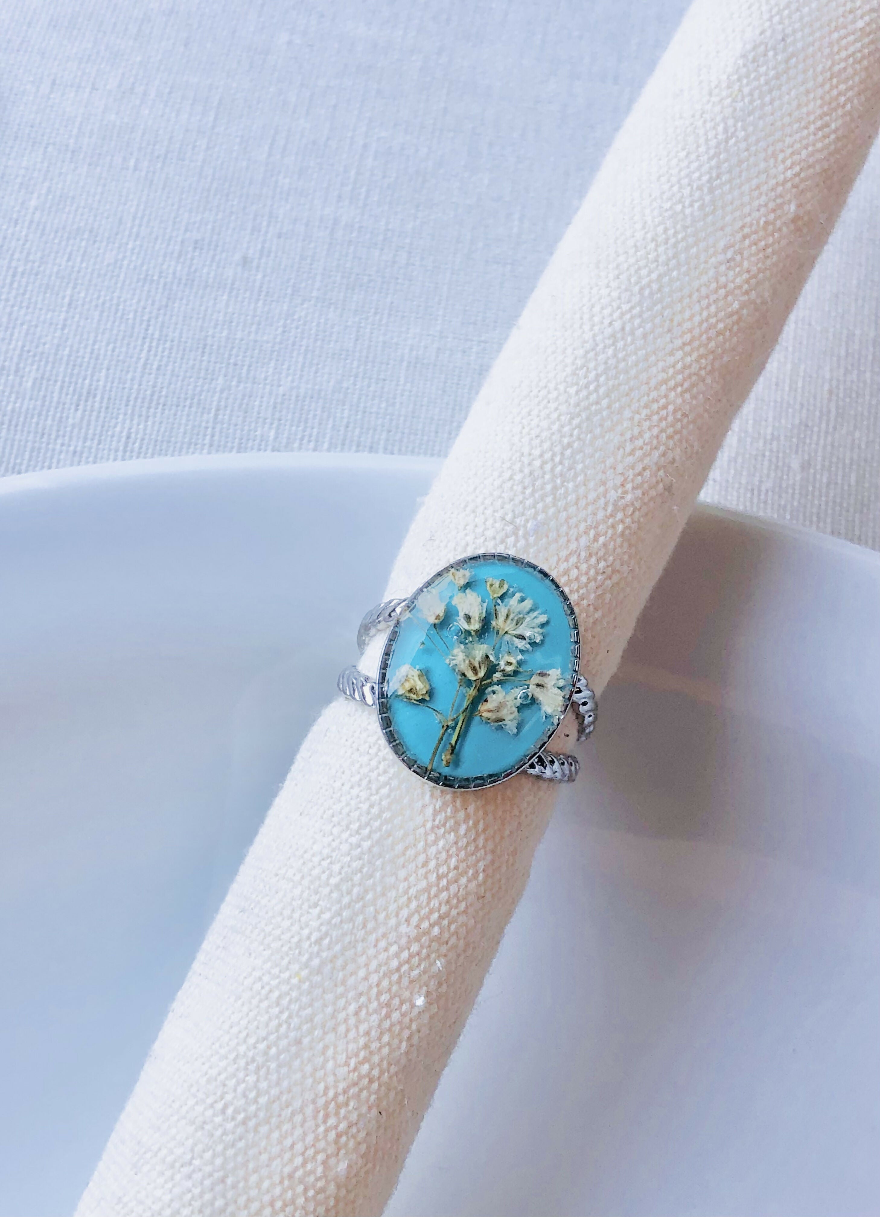 Bague turquoise et fleur de bonheur blanche