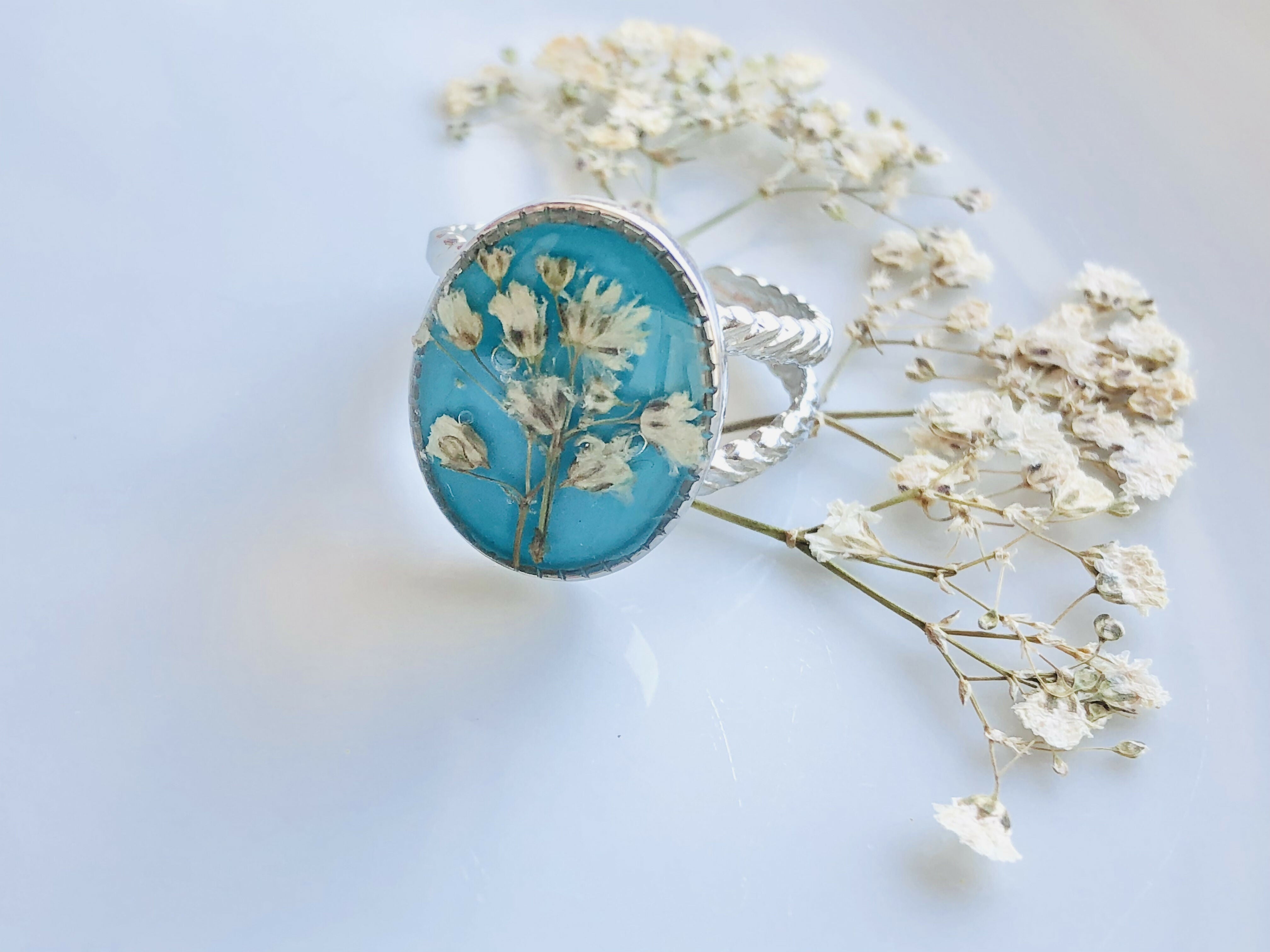 Bague turquoise et fleur de bonheur blanche